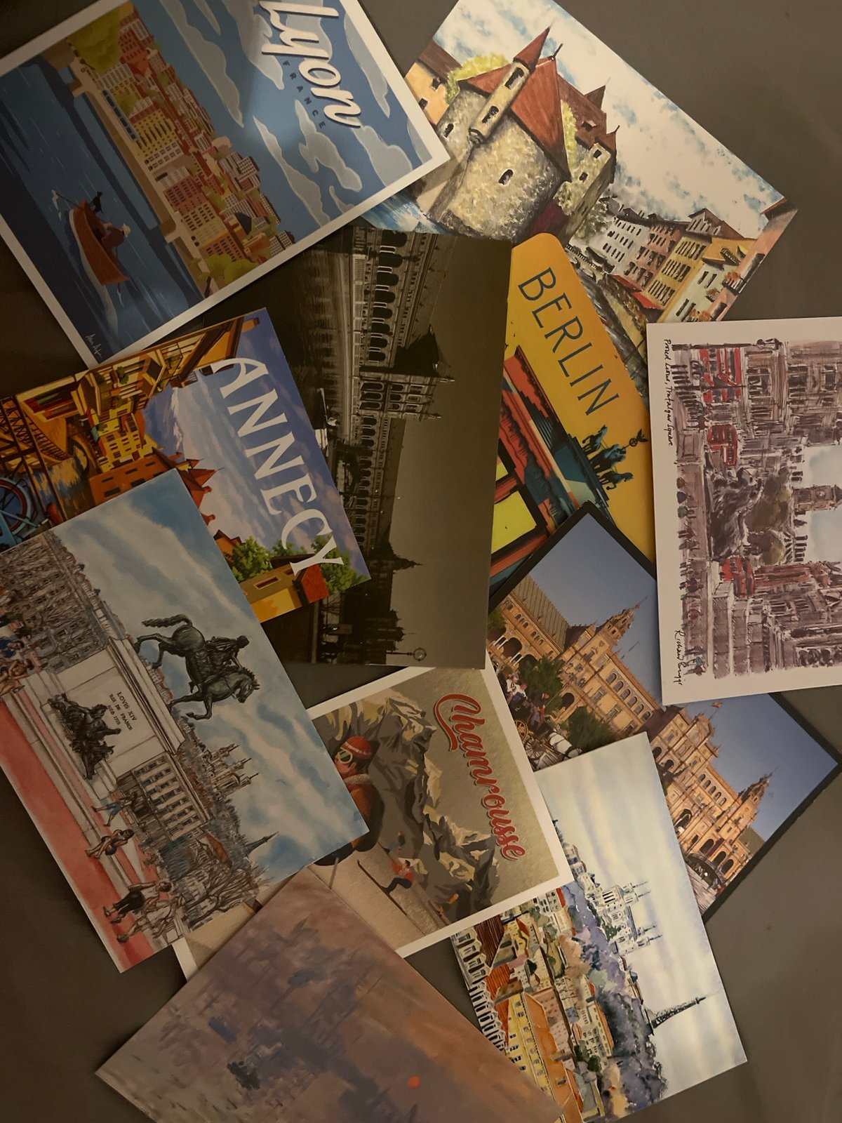 Travel postcard collection documented in Lyon evening session