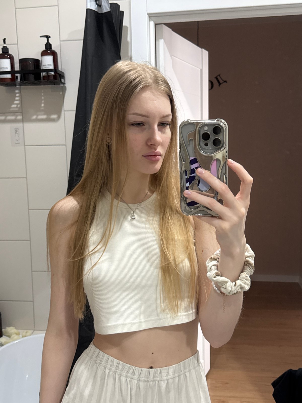 Woman takes bathroom mirror selfies in Perm, Russia