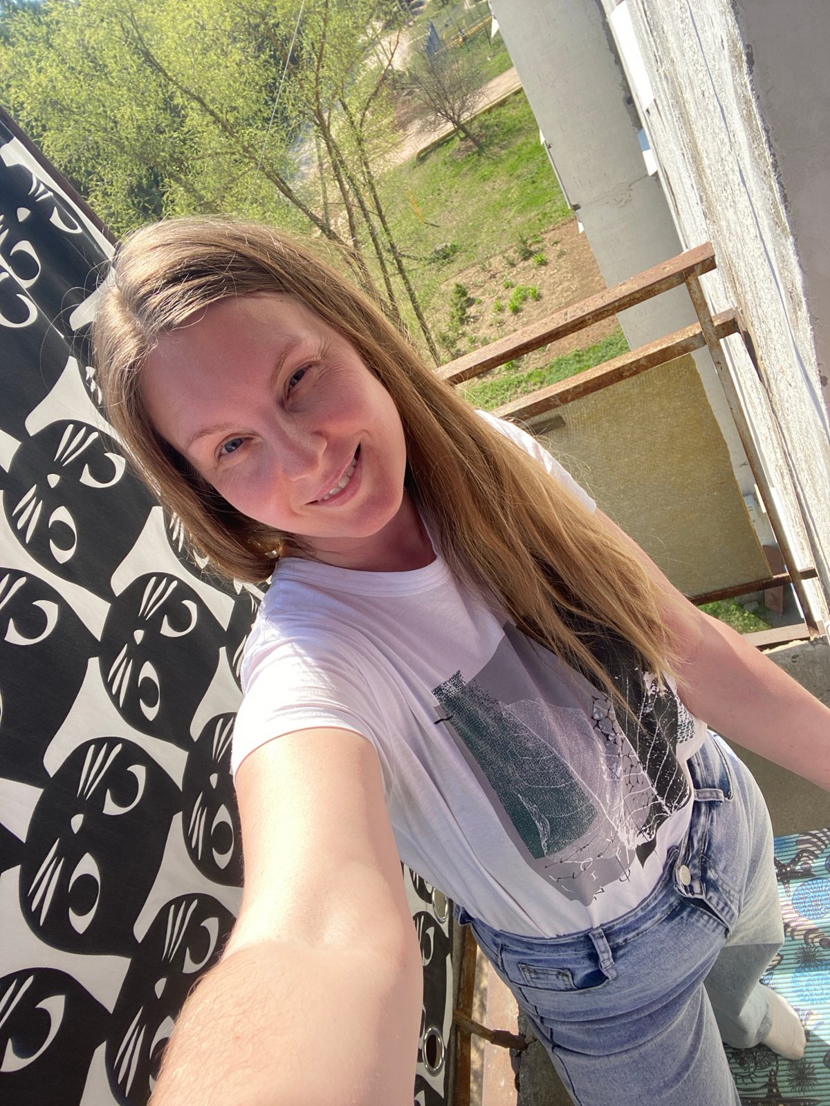 Women take morning selfies in residential areas of Noviy, Russia