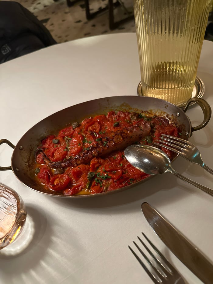 London diner captures octopus and tomato dish presentation