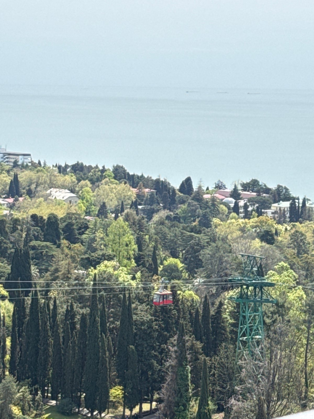 Elevated panoramic view of Sochi's forested hills, Black Sea