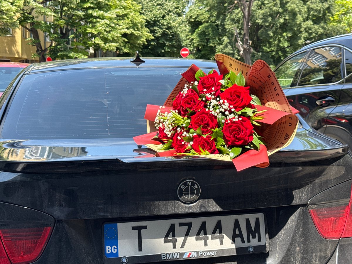 Rose bouquet placed on BMW trunk in Varna