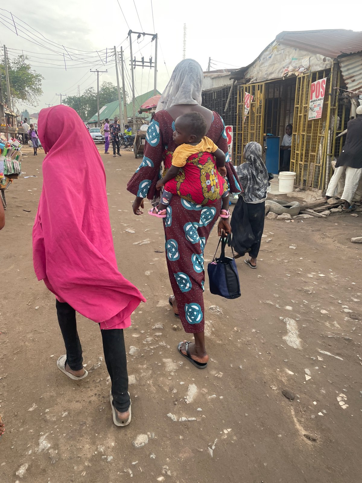 Morning market life documented on Abuja dirt road