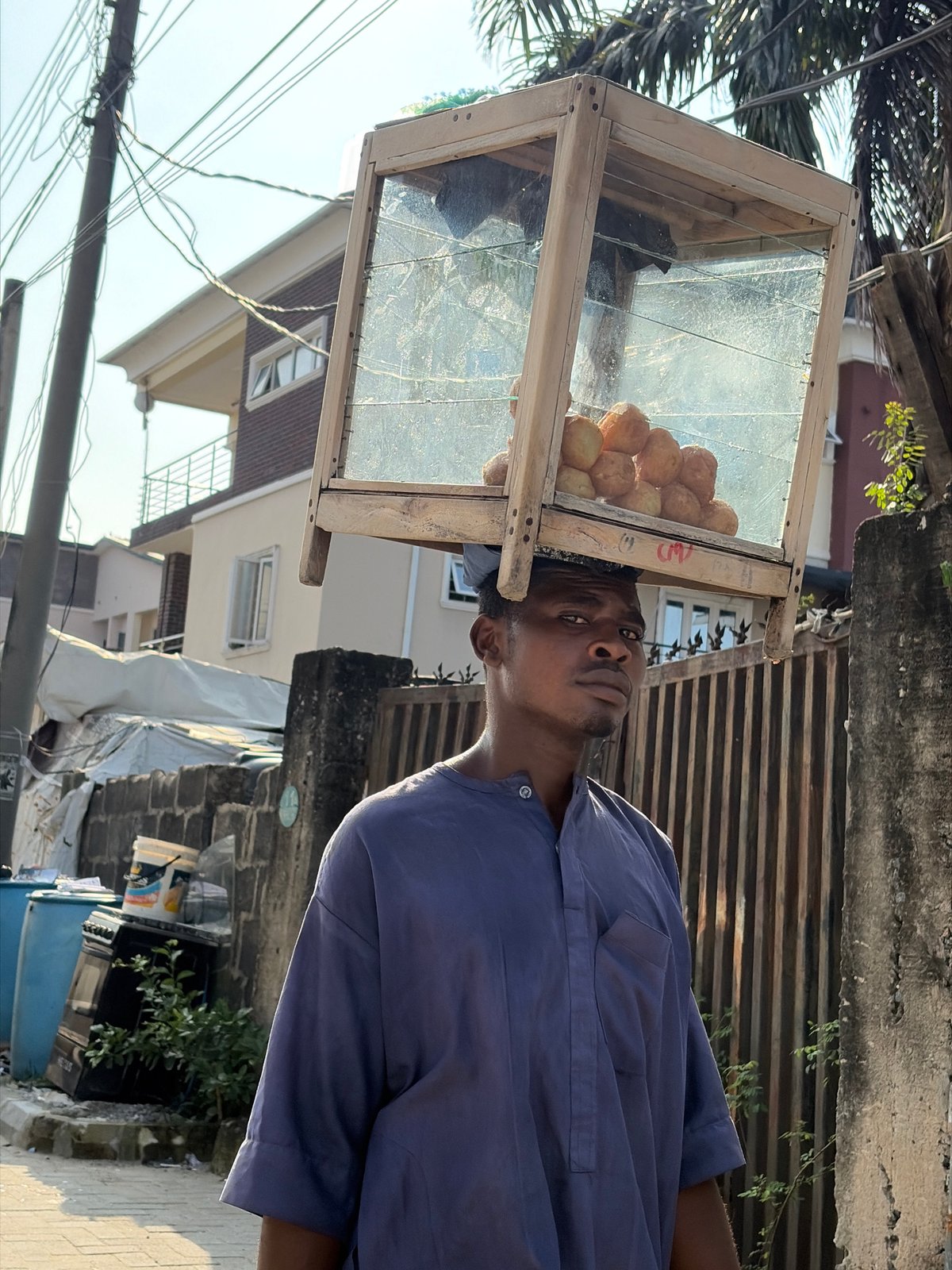 Street life and labor in Igboefon on a July afternoon