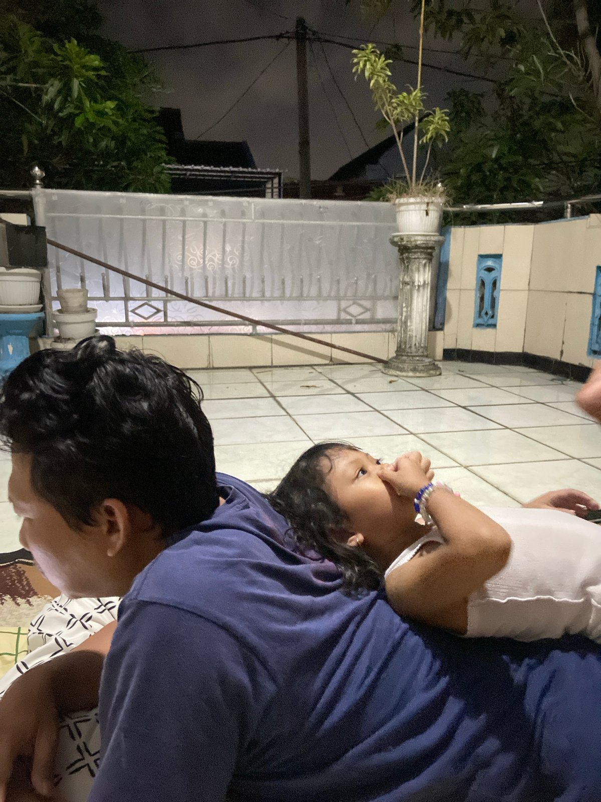 Parent and child share quiet moments in Gelam