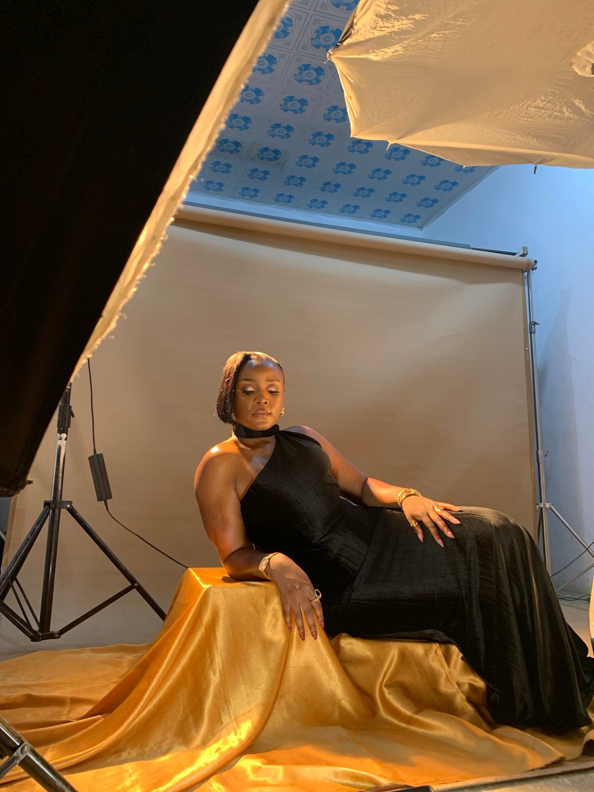 Studio fashion shoot on gold satin, Gura Top, Nigeria