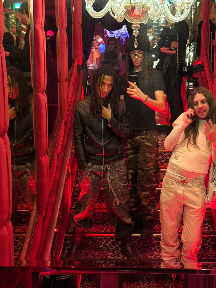 Nightclub gathering observed at Paris venue with red lighting