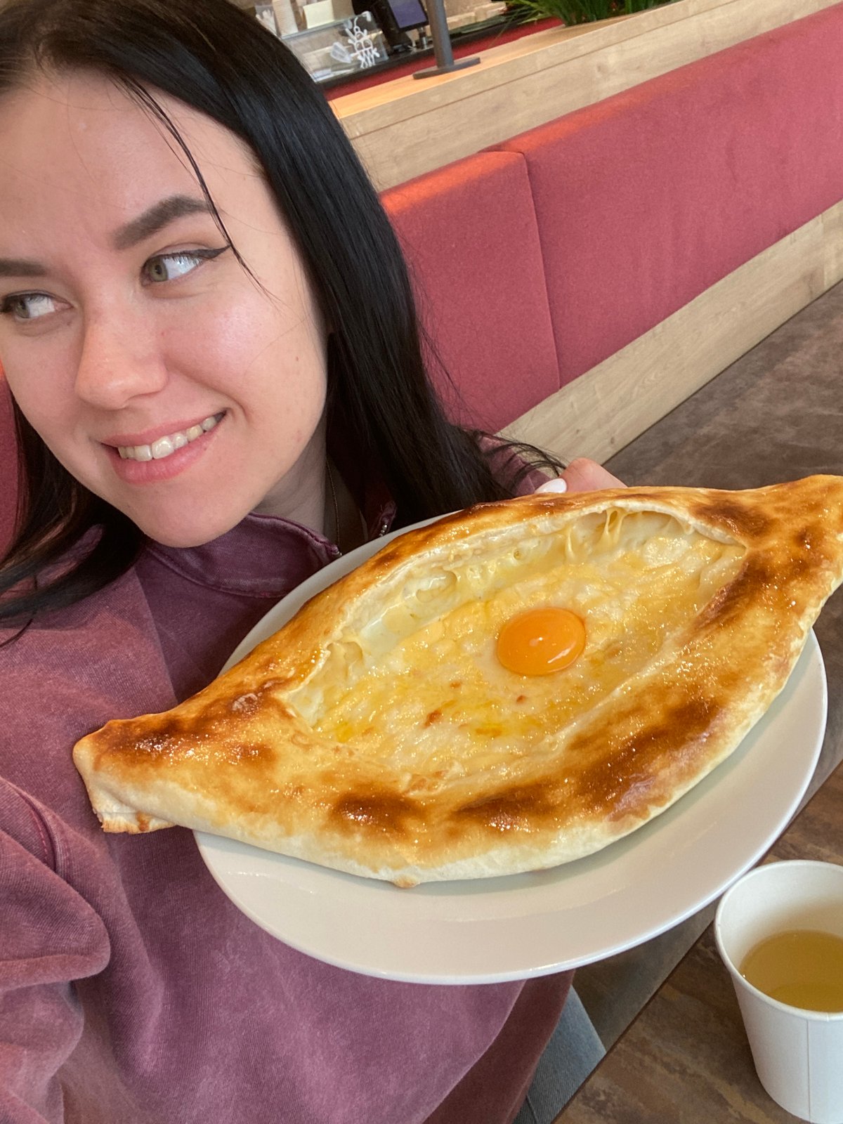 Woman documents gallery visit and Georgian meal in Perm