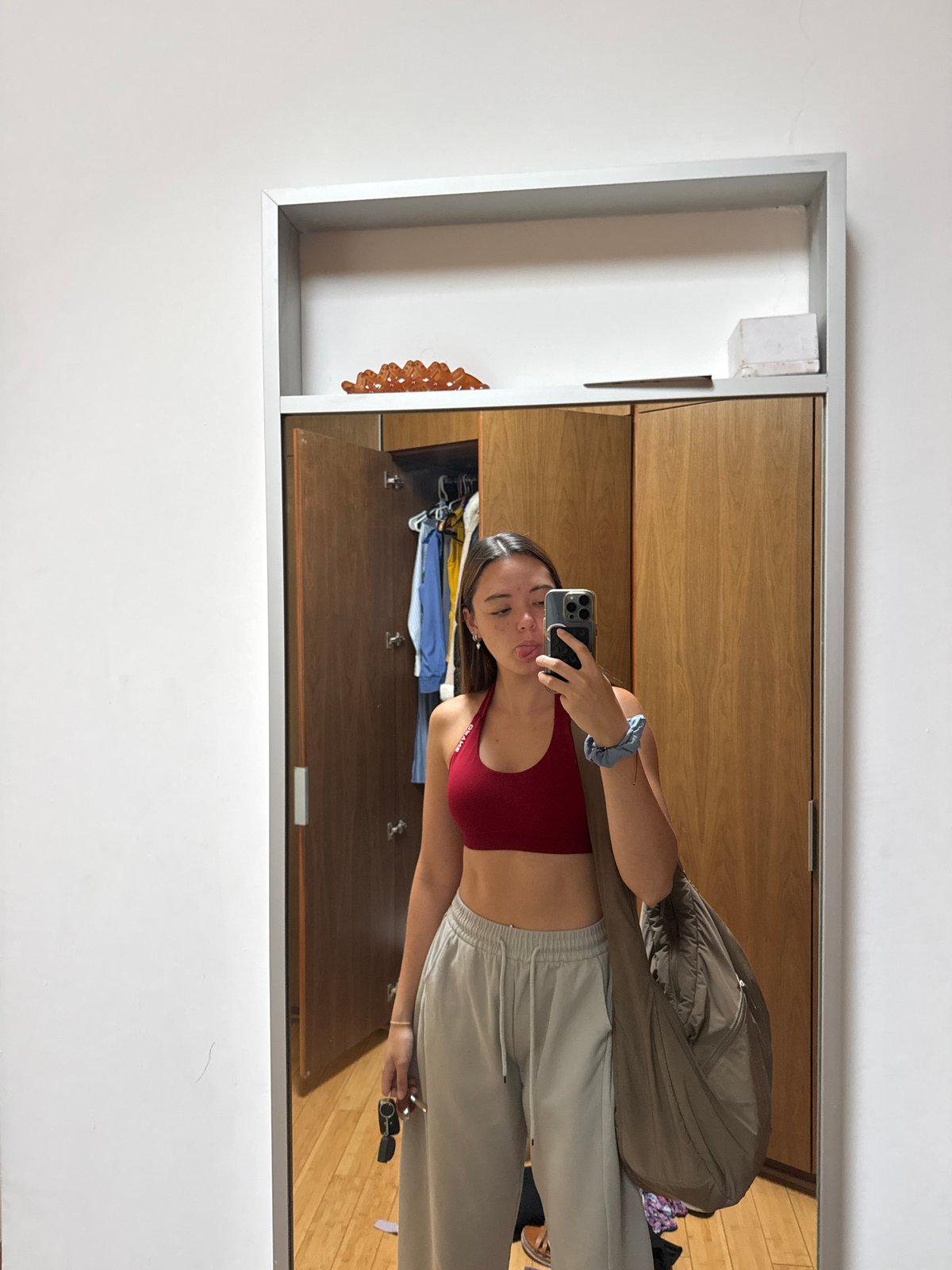 Woman takes mirror selfie in athletic wear in Mexico