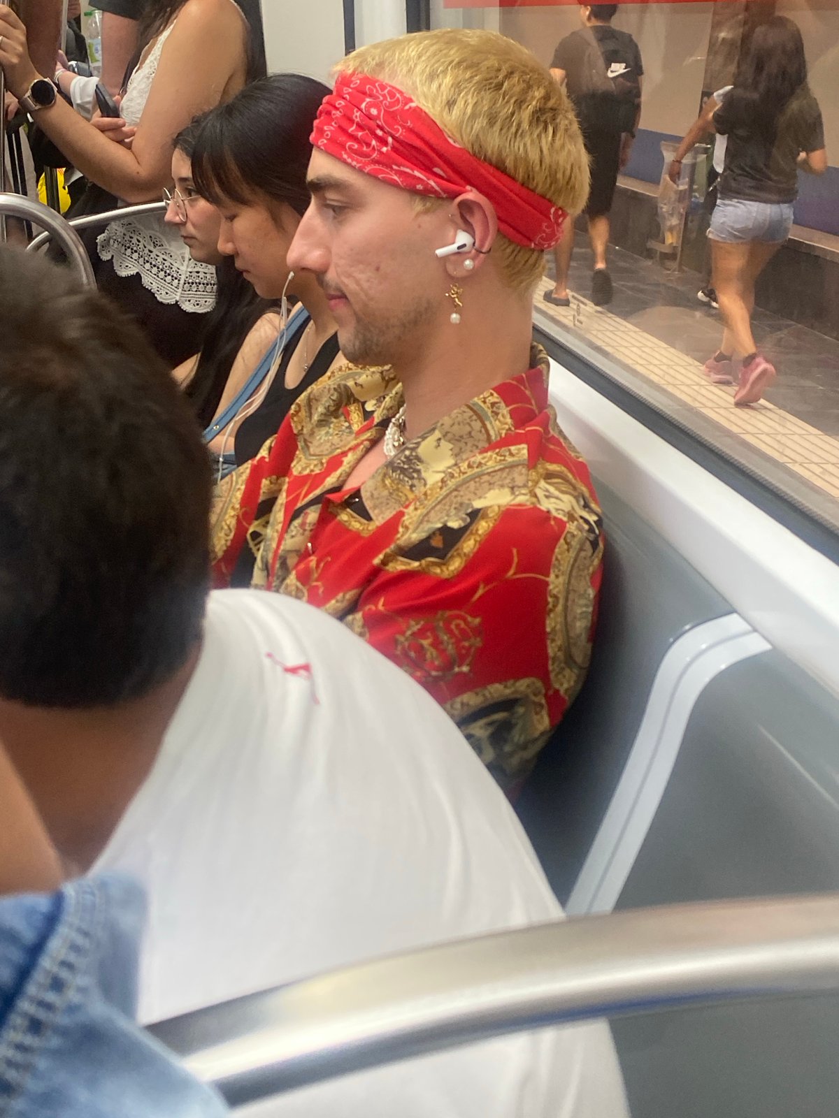 Blonde passenger on public transit in L'Hospitalet de Llobregat