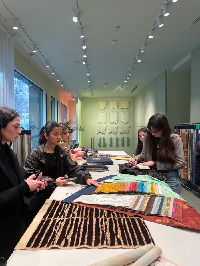 Design consultation observed at Milan textile showroom