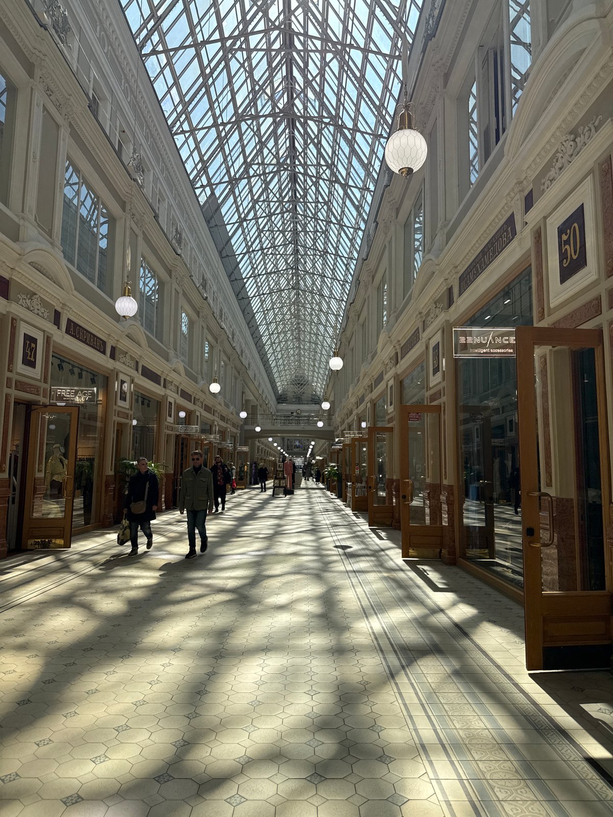 Tourist documents historic Saint Petersburg landmarks during morning walk