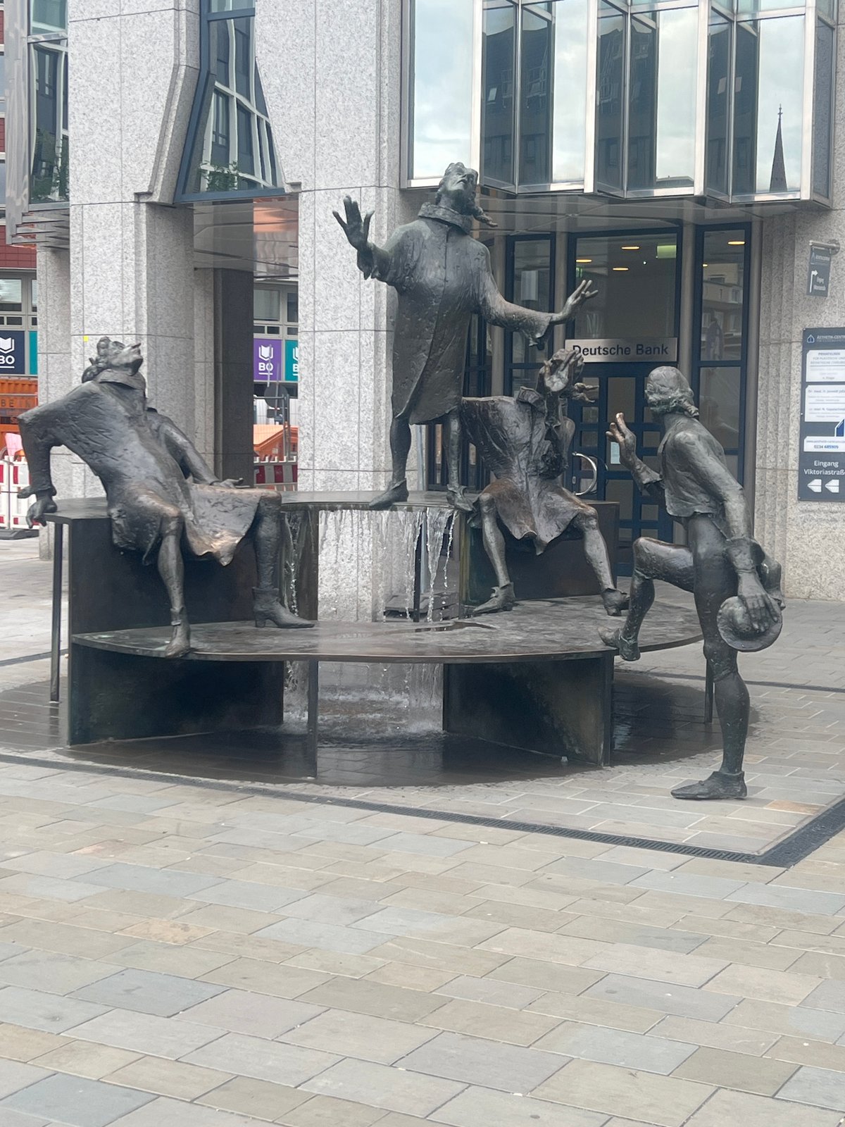 Bronze fountain sculpture with four figures in Bochum