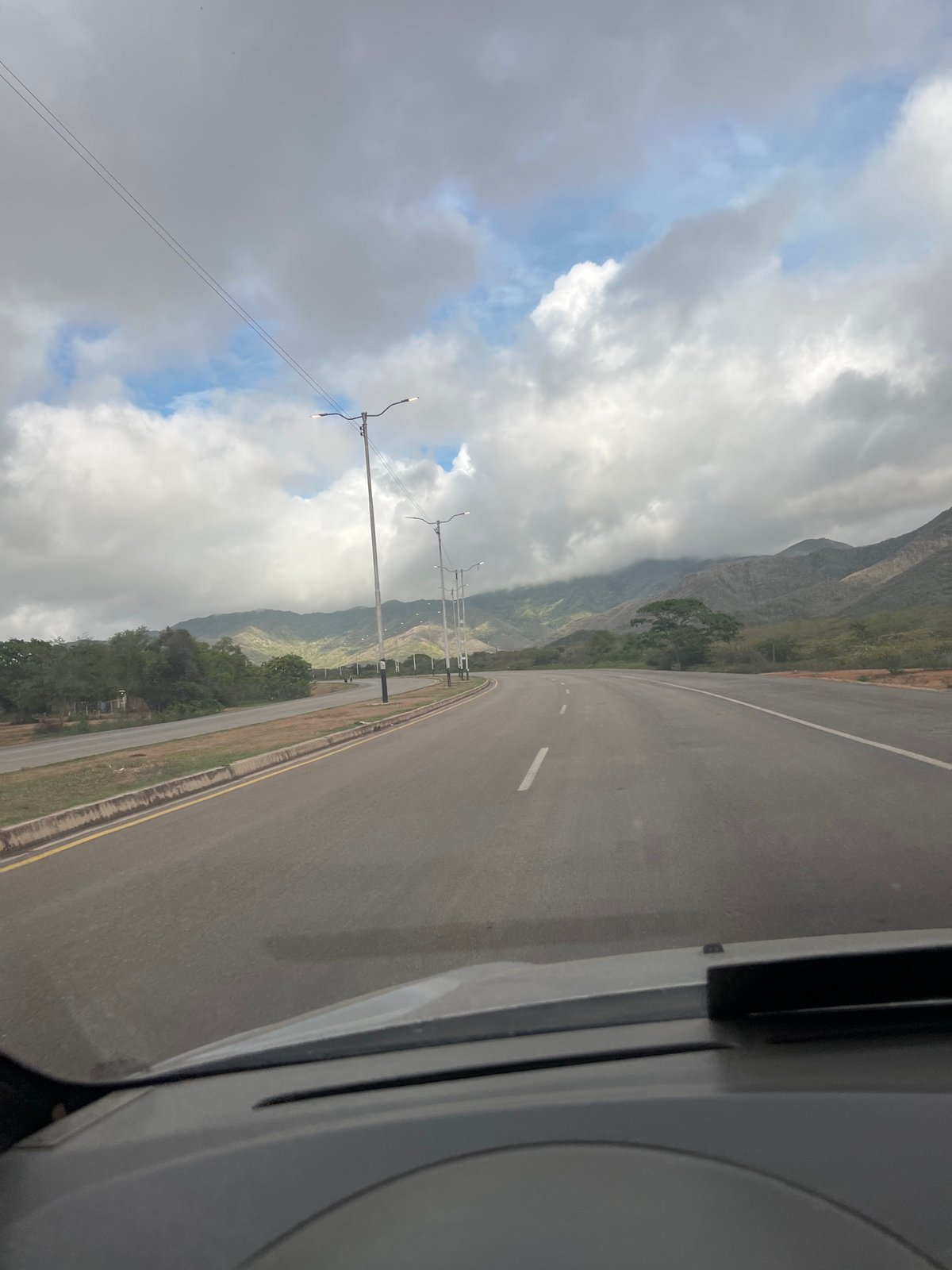 Driving through Santa Ana's highway with mountains ahead