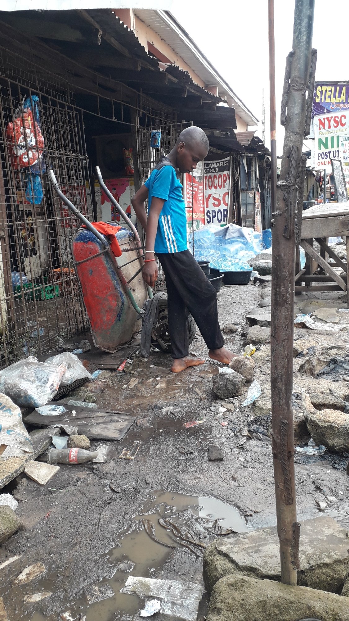 Afternoon street life in Onitsha's informal urban neighborhoods