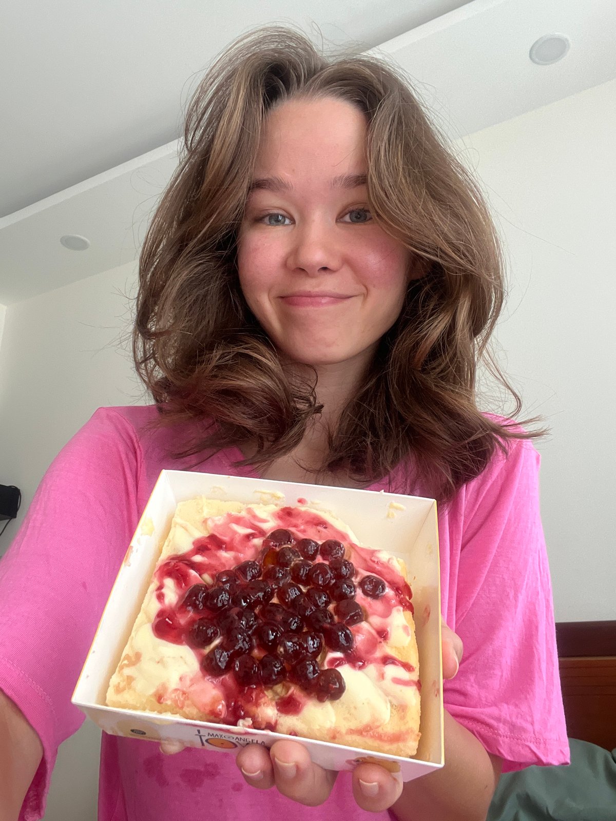 Woman holds pastry dessert at Vietnam heritage site