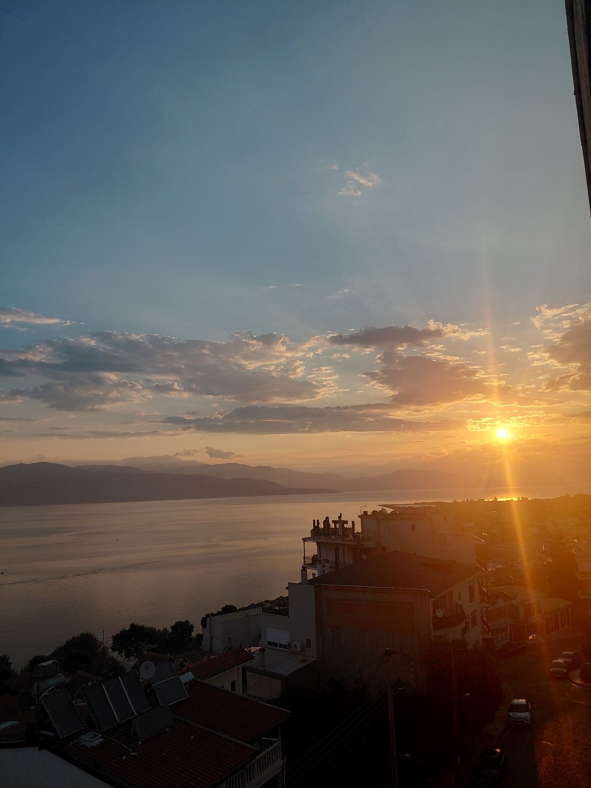 Aegio coastline at golden hour, ground and aerial views