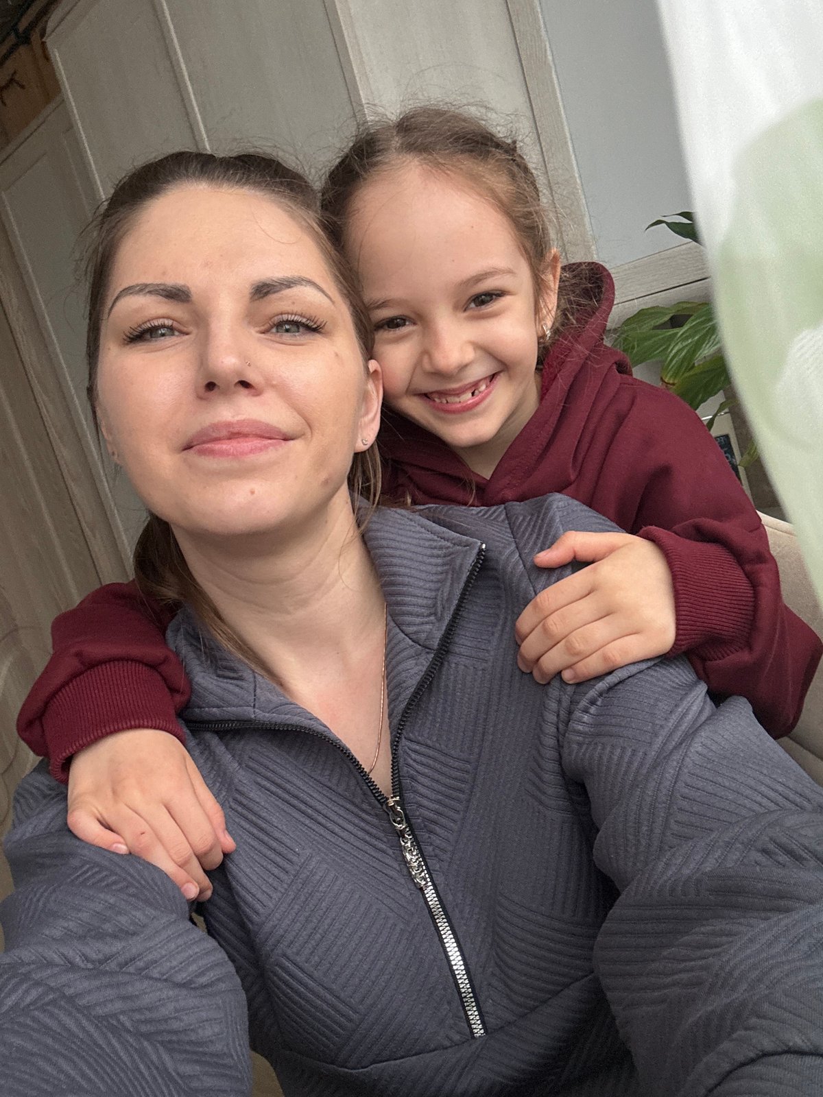 Mother and daughter photographed together in Razdolye home