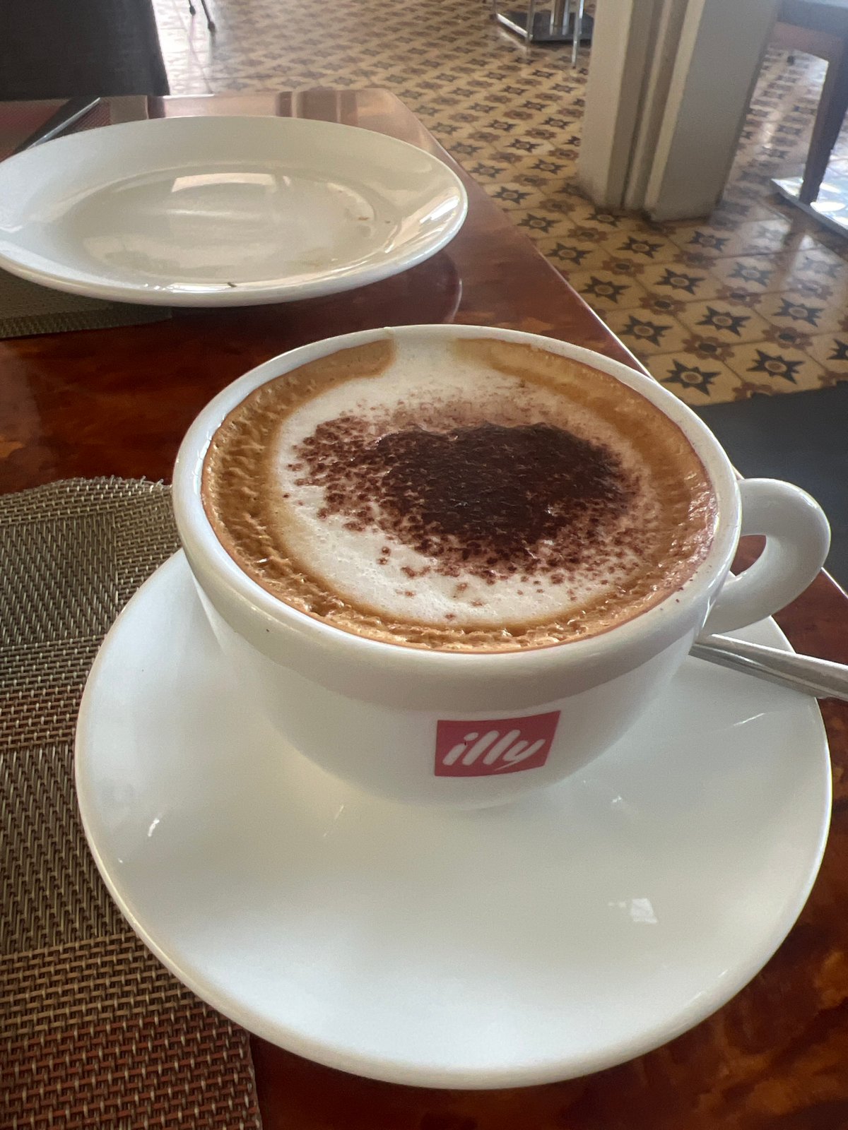 Tourist documents breakfast spread at Siem Reap restaurant