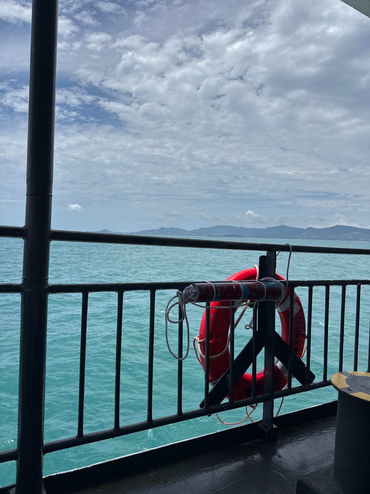 Ferry deck life preserver, calm turquoise waters off Ko Pha-ngan