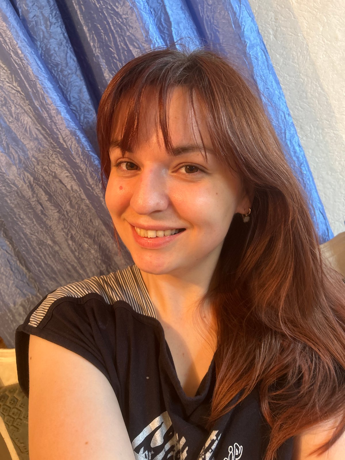 Woman photographed in rural Russian village during afternoon
