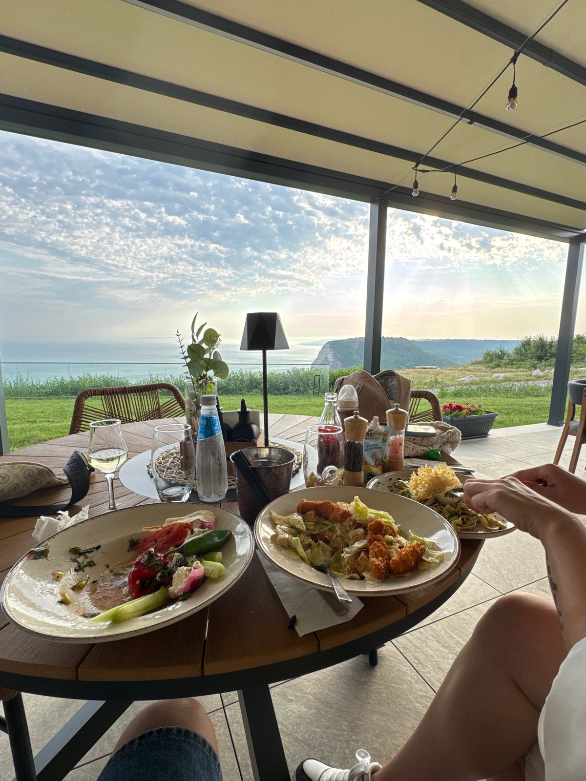 Pesto pasta lunch on a cliffside patio in Kavarna