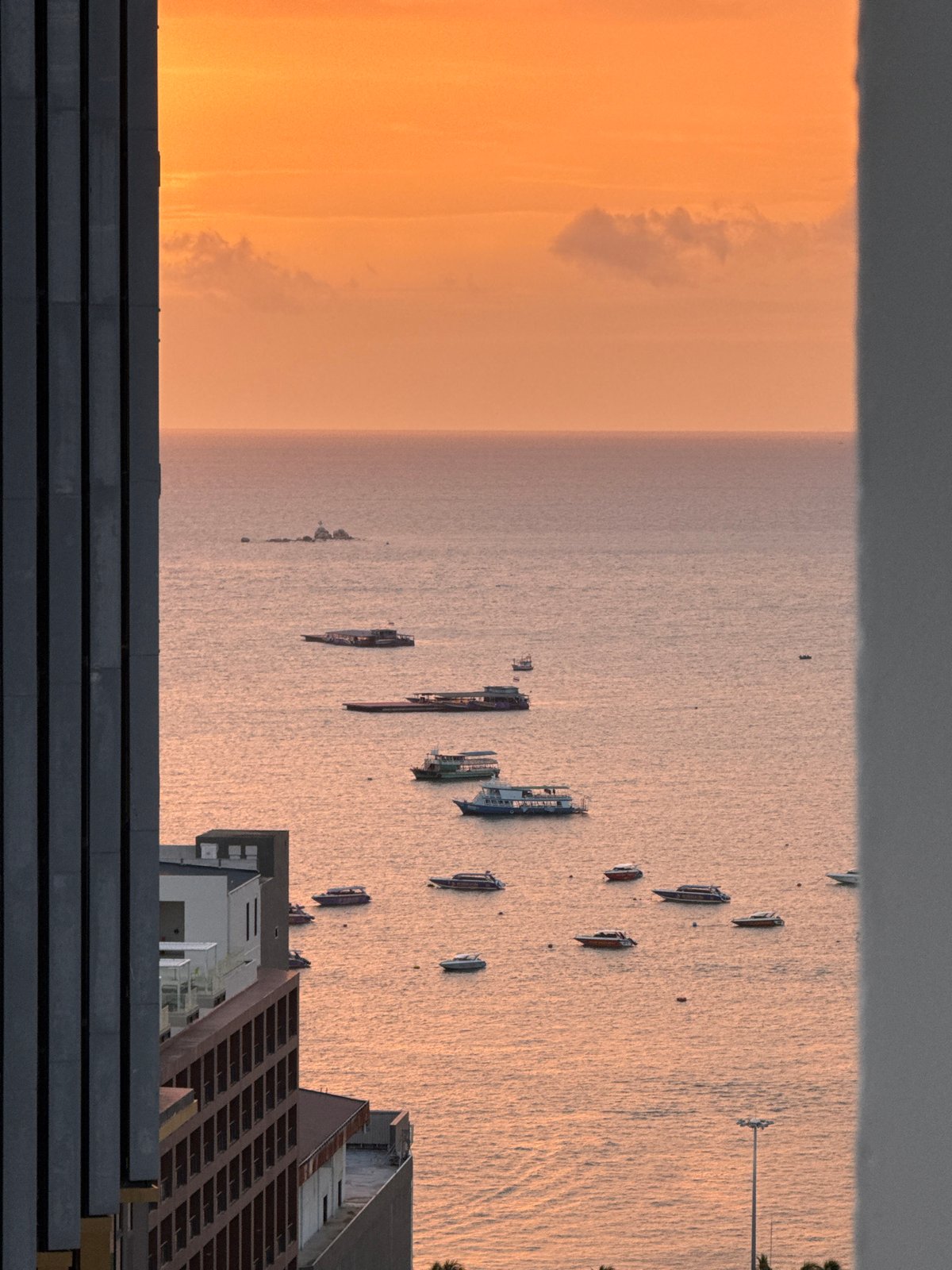 Aerial sunset views over Pattaya's coast and cityscape