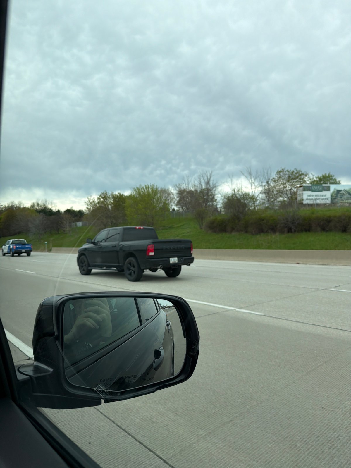 Highway traffic observed near Toronto featuring black pickup trucks