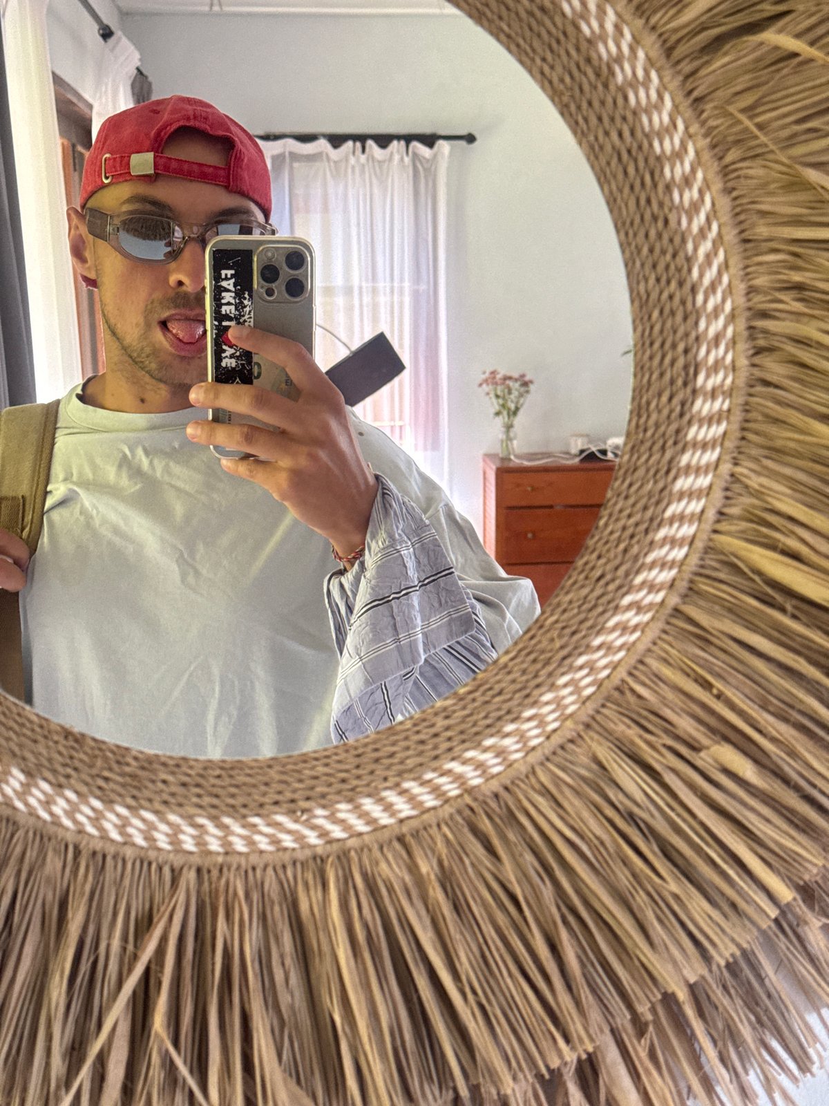 Mirror selfie with backpack in a Bali room