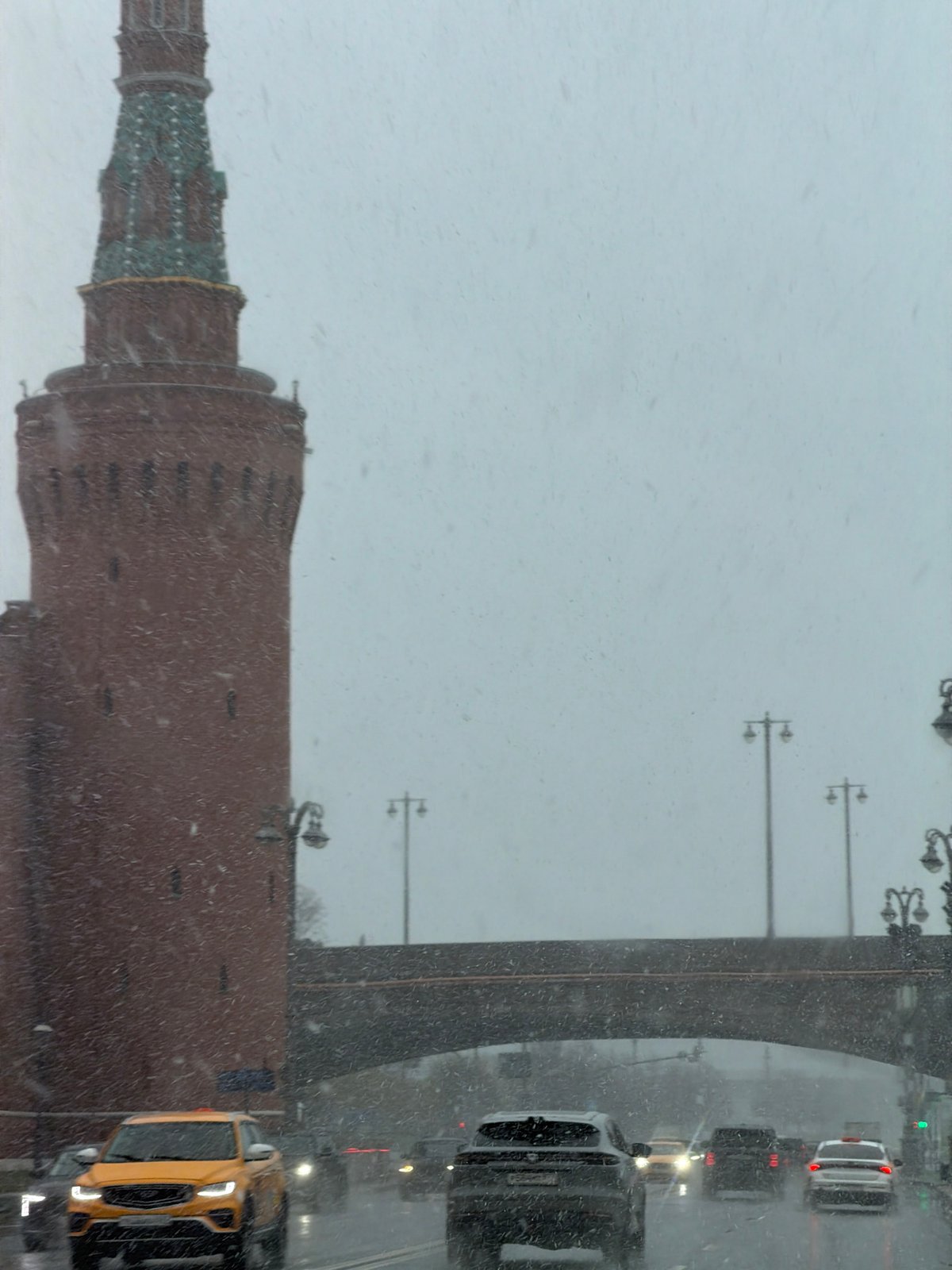 Moscow scenes documented during snowy spring day across city