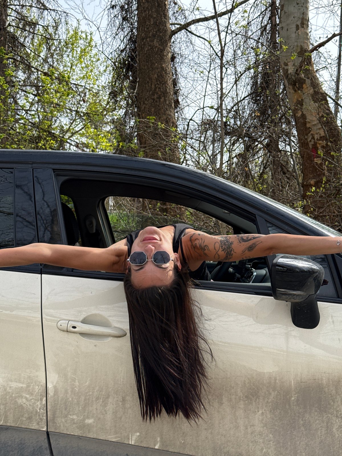 Woman leans from car window in Pleven, Bulgaria