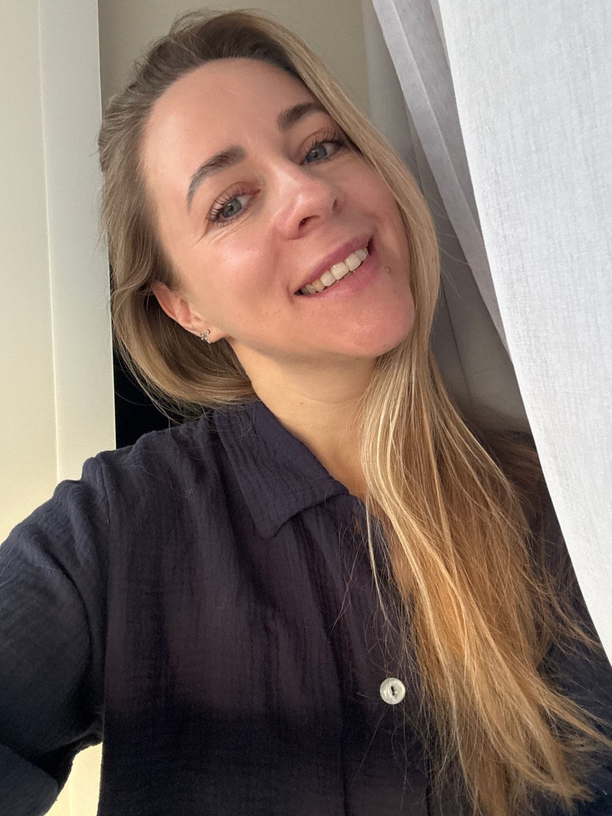 Woman takes selfie indoors in Chaikovsky, Russia
