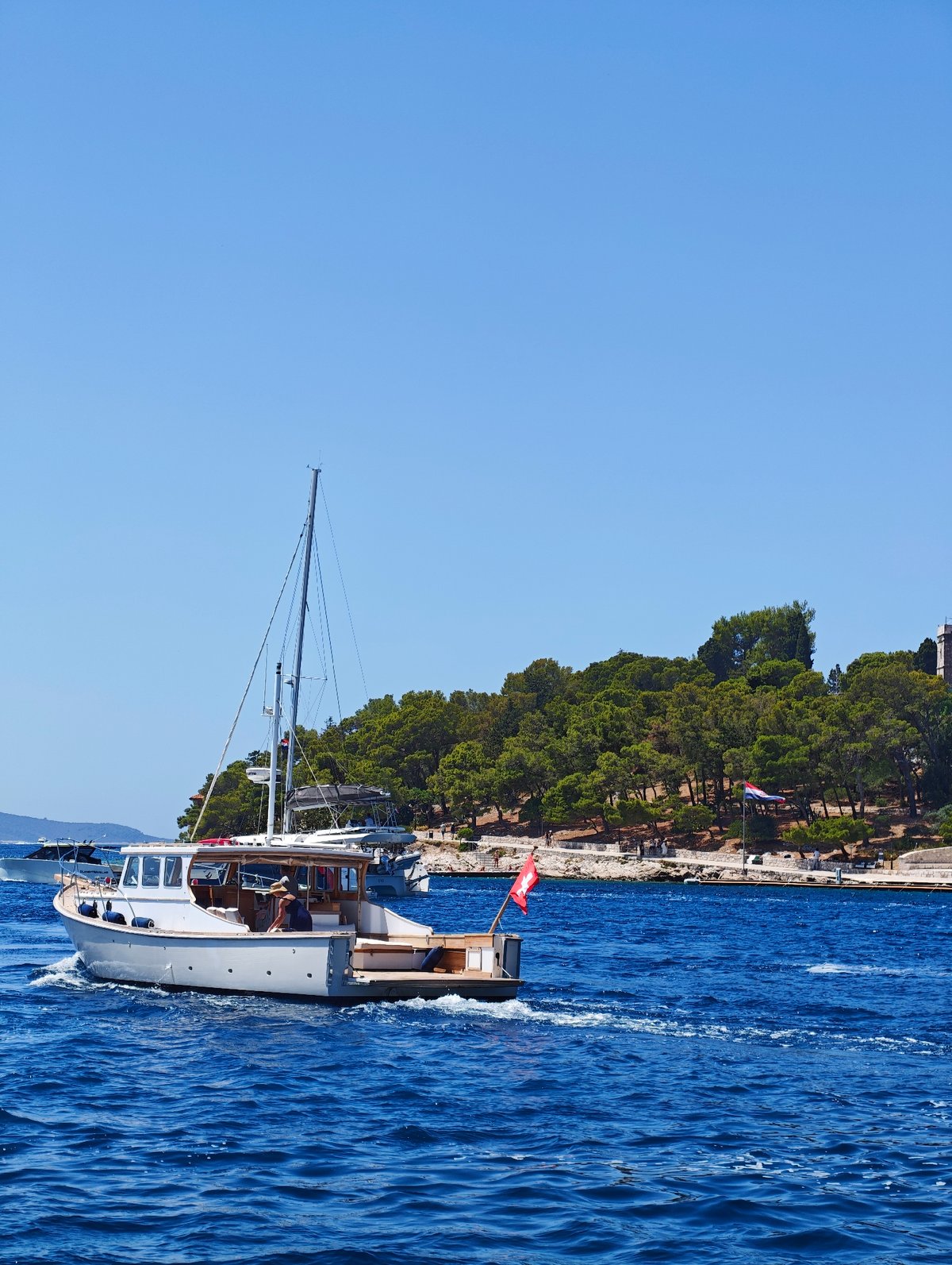 Hvar's waterfront and Adriatic sea on a clear summer morning