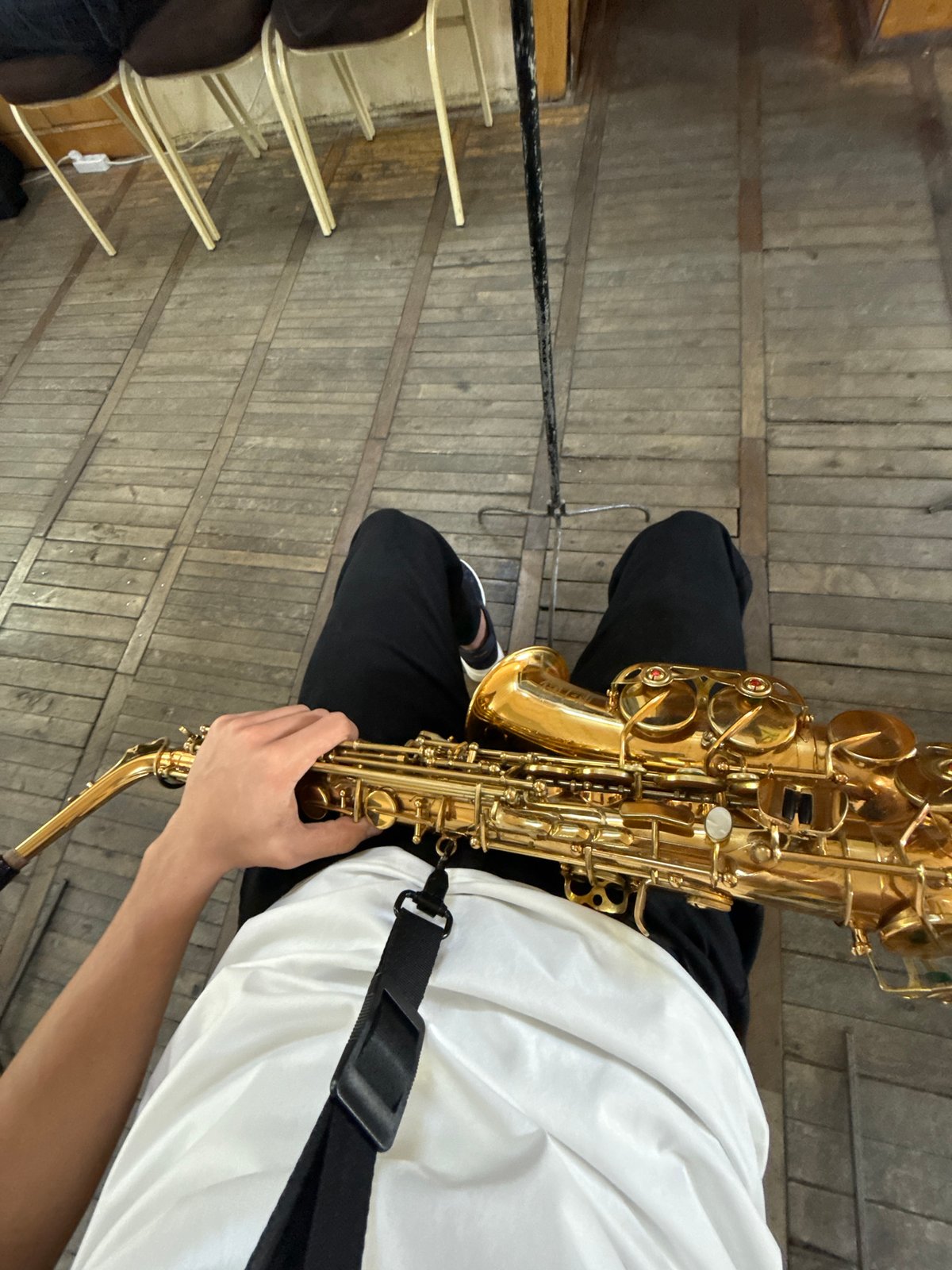 Musician with saxophone spotted in Yerevan indoor space