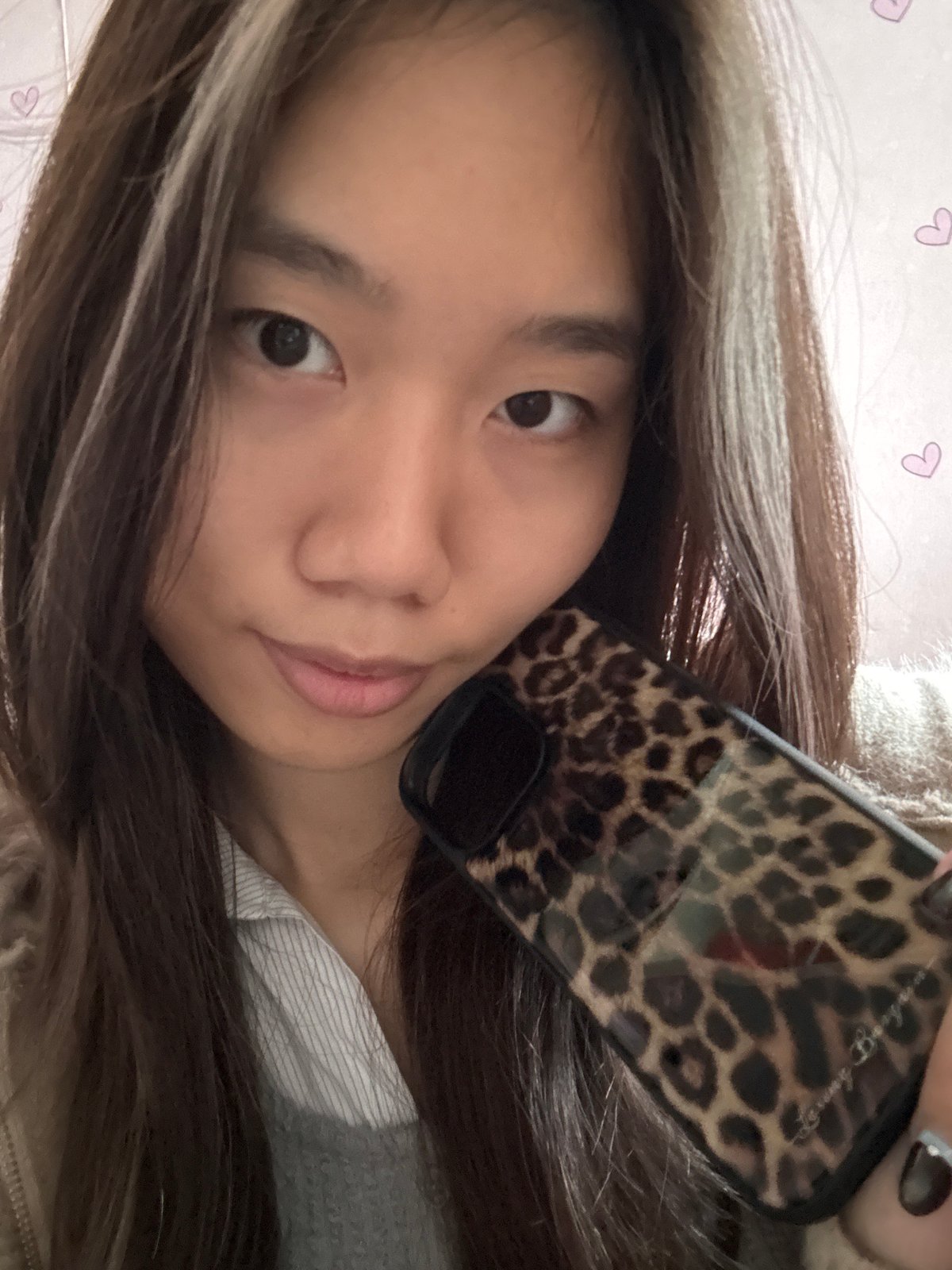 Woman takes multiple selfies with props in Chongqing apartment