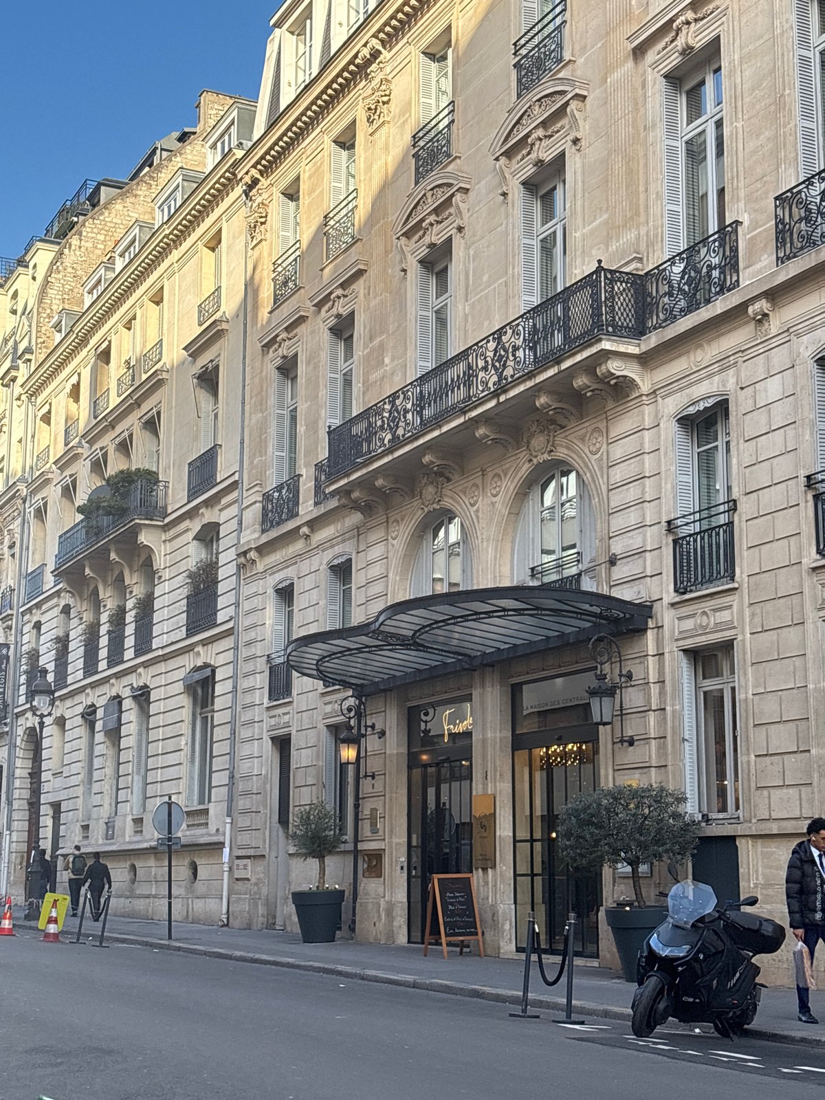 Morning street scenes capture classic Parisian architecture and delivery truck