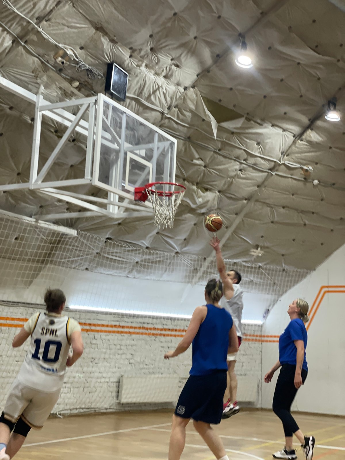 Basketball game underway at Saint Petersburg gymnasium