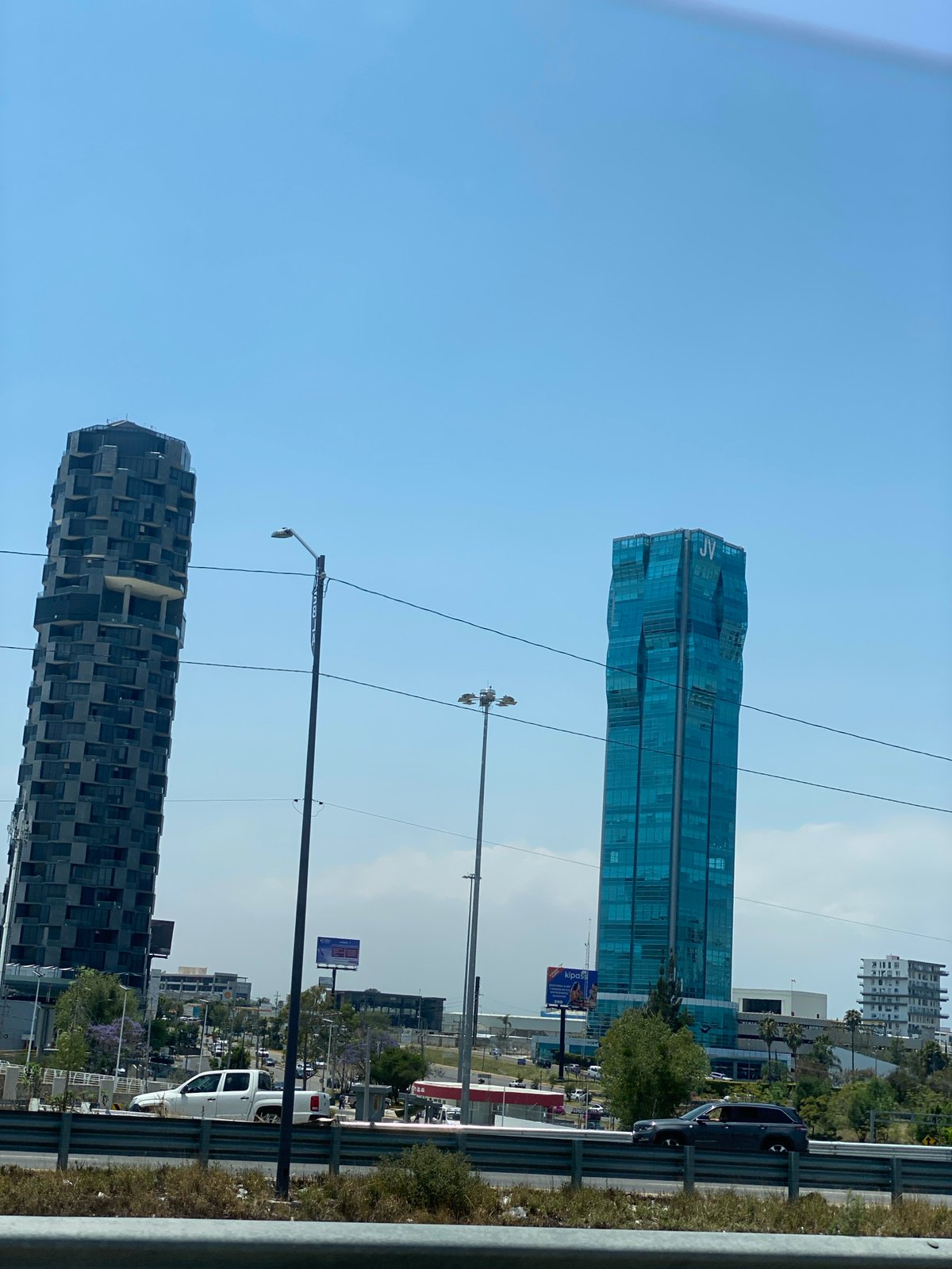 Urban buildings documented under clear blue sky