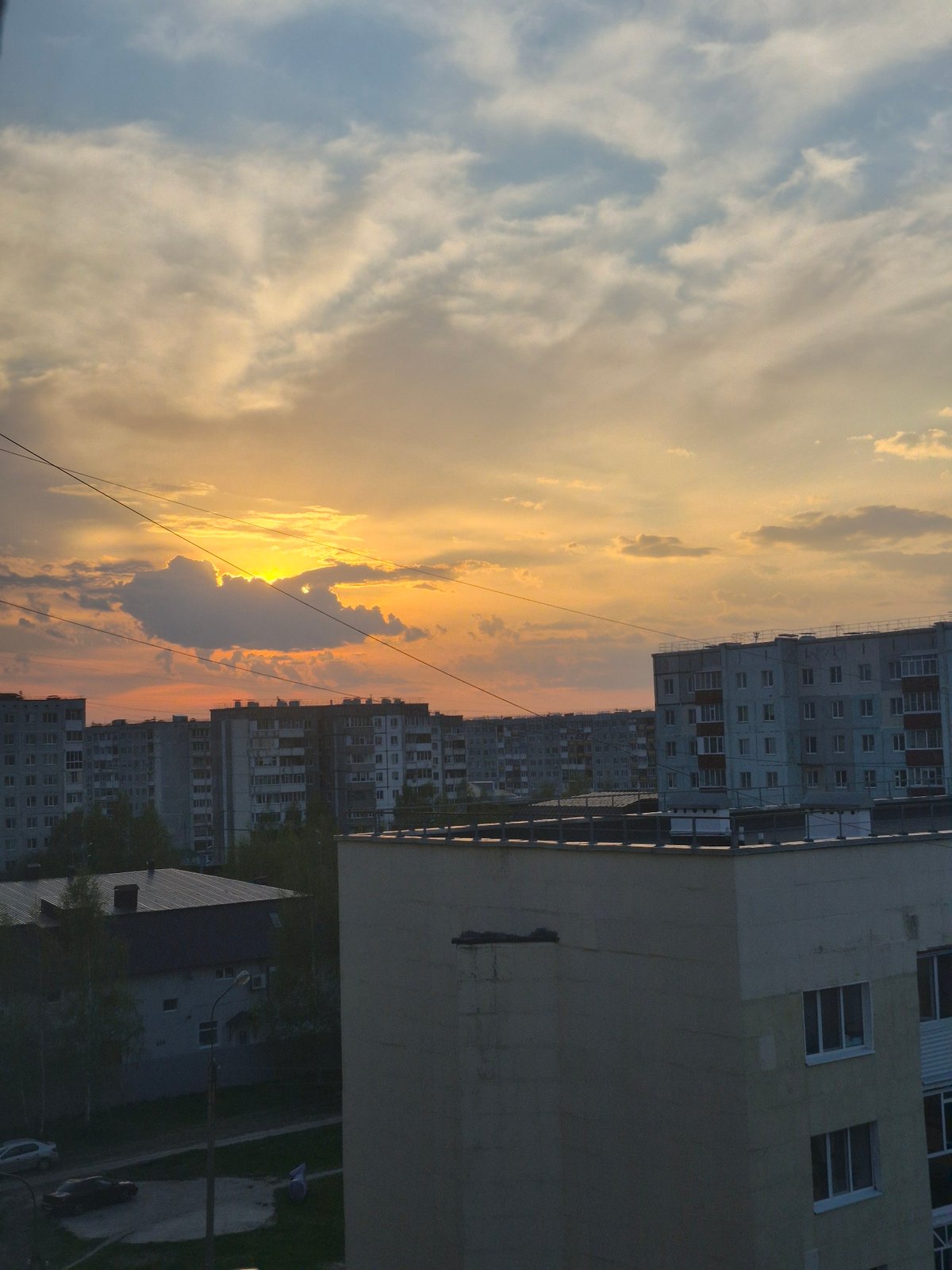 Mixed urban observations: sunset cityscape and Cyrillic whiteboard documented