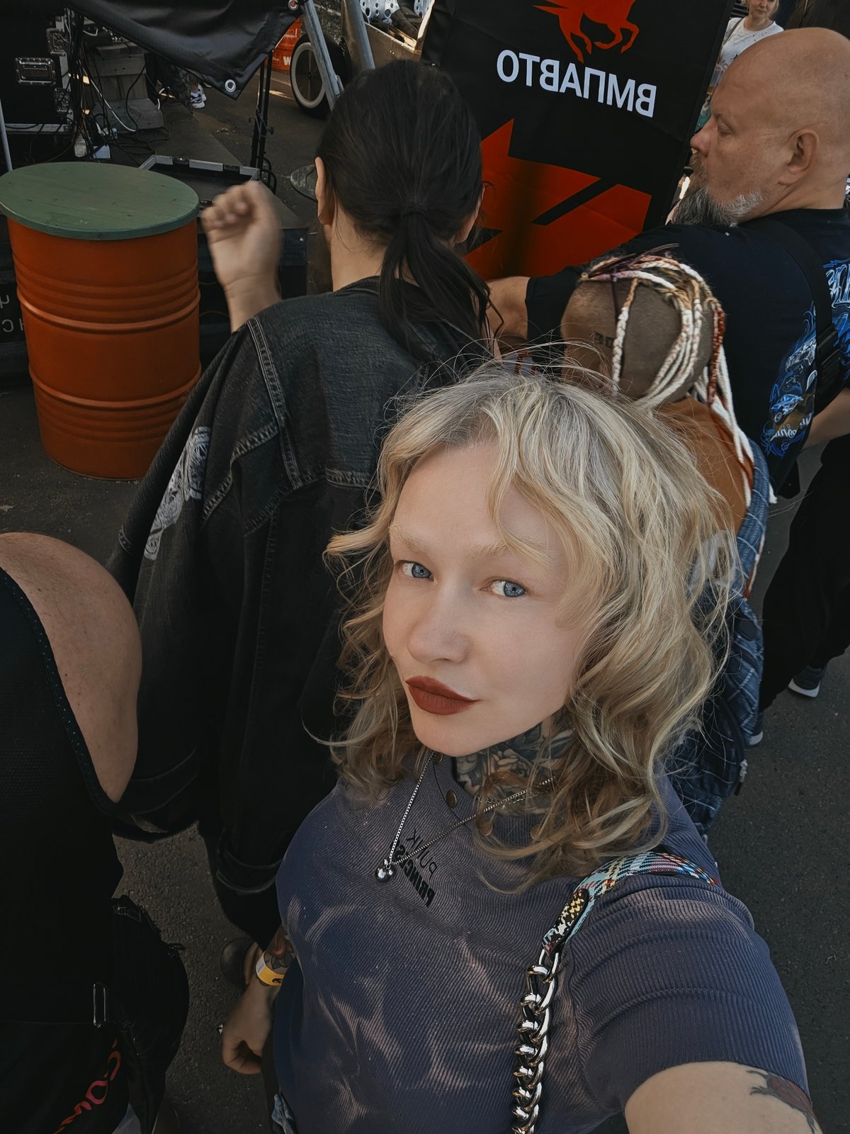 Live music and festive crowd at an outdoor summer event