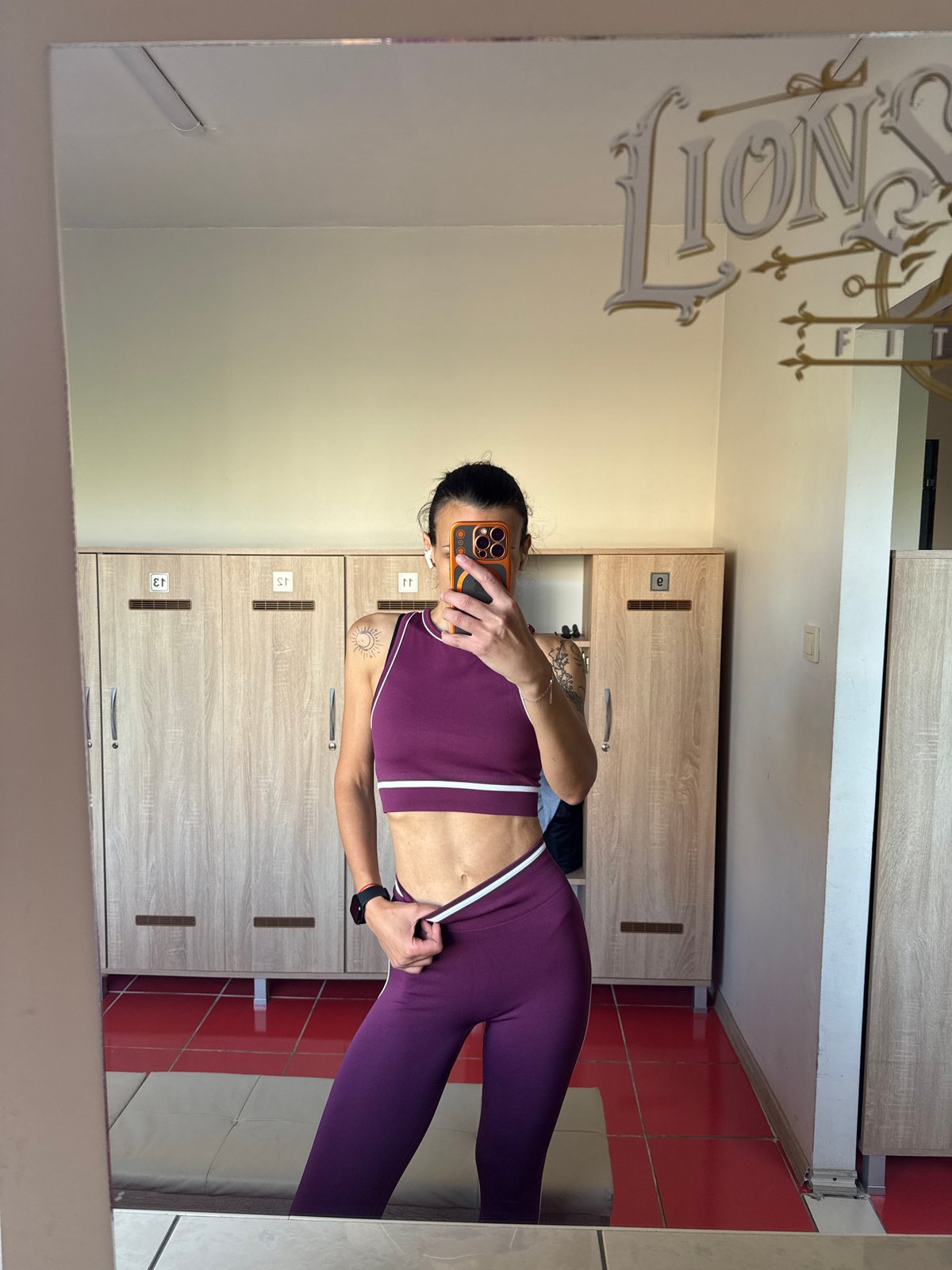 Woman takes mirror selfie in Pleven gym changing room
