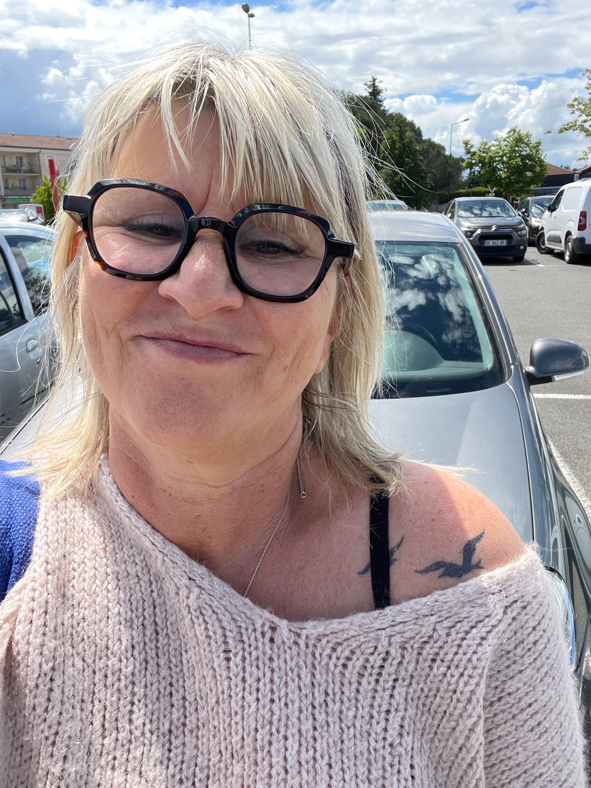 Woman visits flower nursery in Saint-Galmier, takes selfie