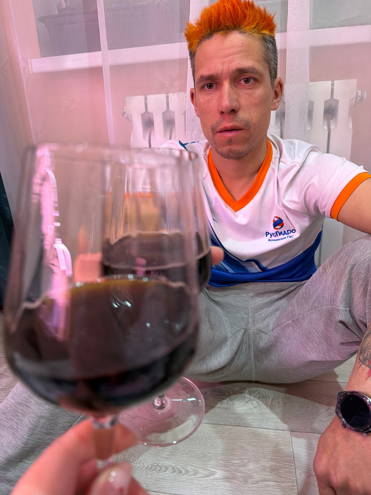Two people share drinks in casual indoor gathering, Chaikovsky