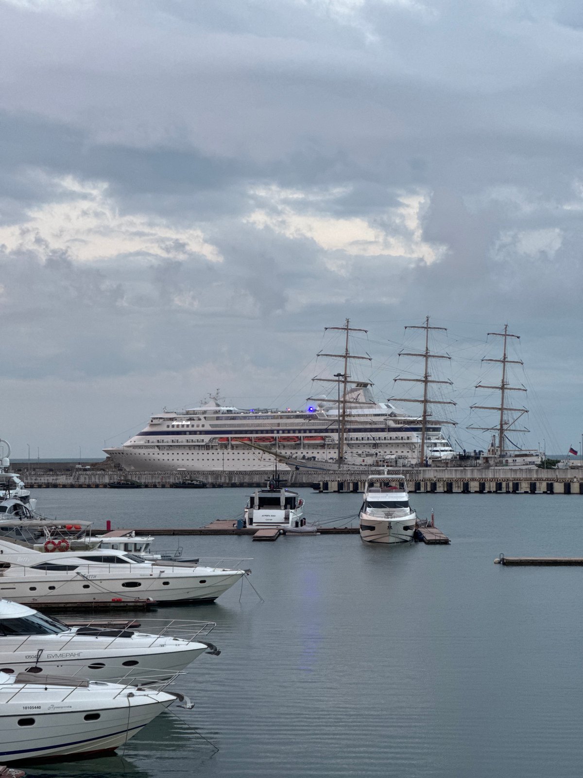 Sochi harbor at dusk: cruise ships, tall ships, and packed marina