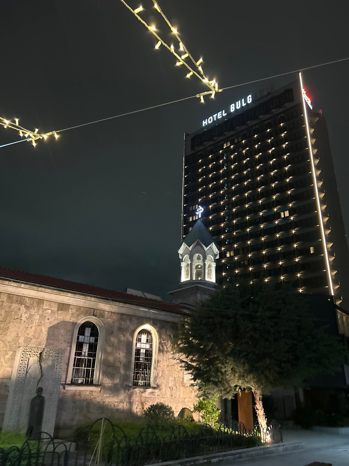 Evening stroll through illuminated Burgas captures local nightlife scene