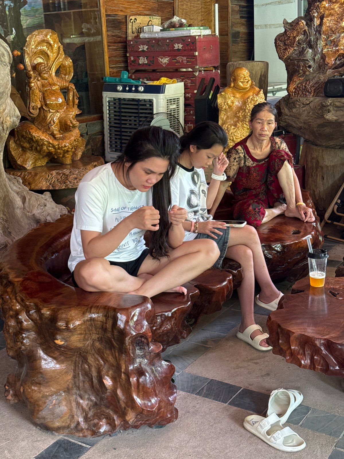 Tourists explore traditional wooden cafes in rural Vietnam