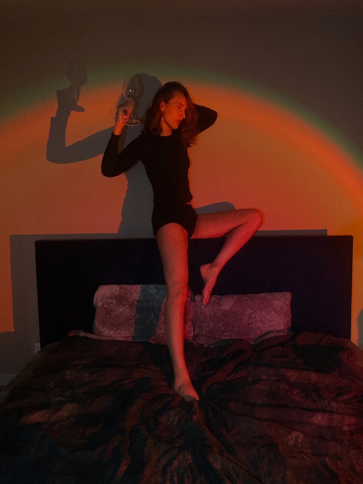 Woman relaxes with wine glass in Russian home