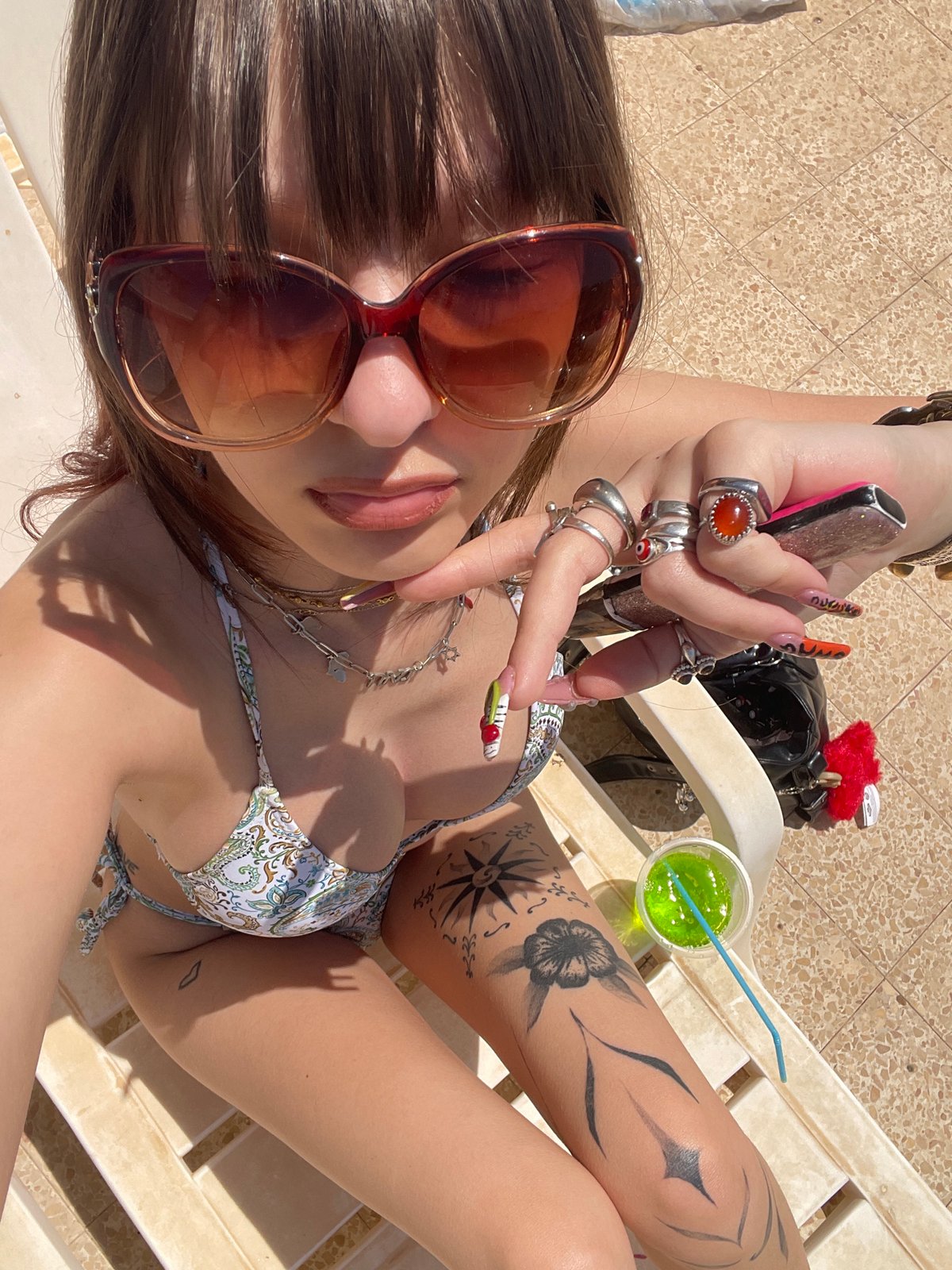 Woman sunbathes on lounge chair in Petah Tikva