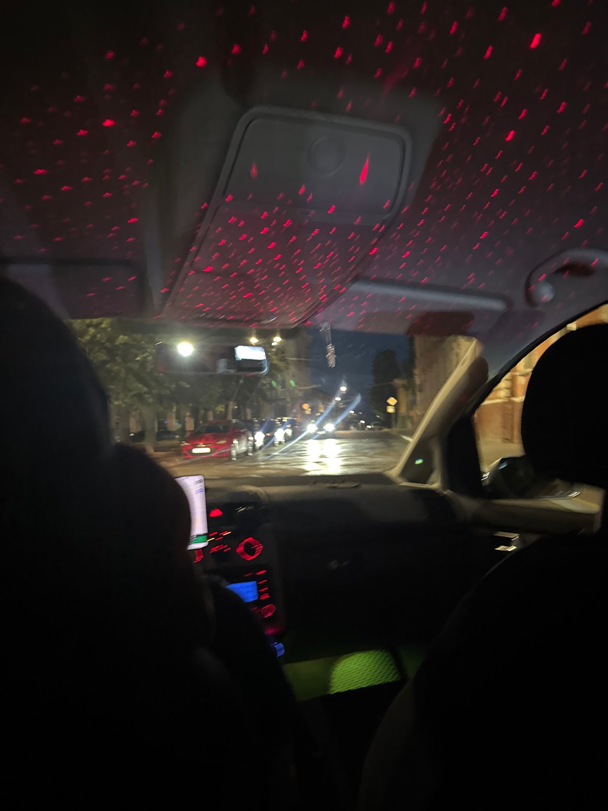 Night drive through Chernivtsi, red light patterns inside the car