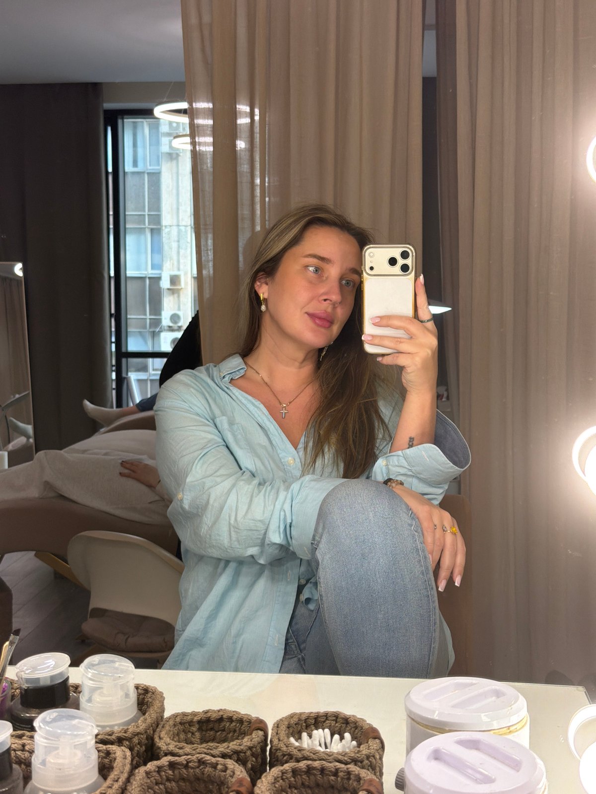 Woman takes selfies in Moscow room Saturday afternoon